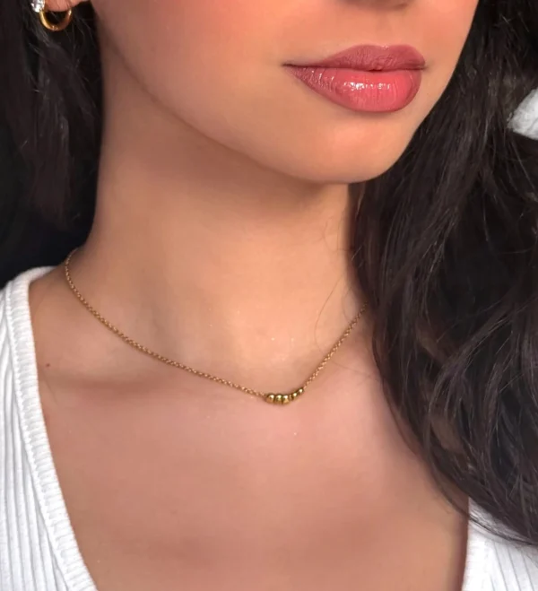 a woman wearing a necklace