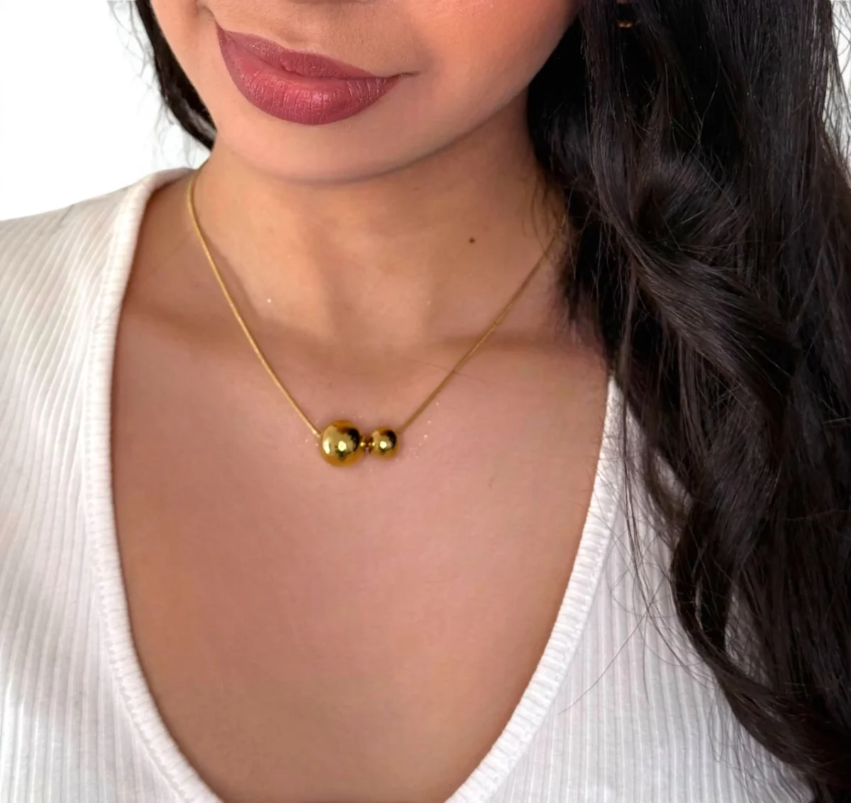 a woman wearing a necklace