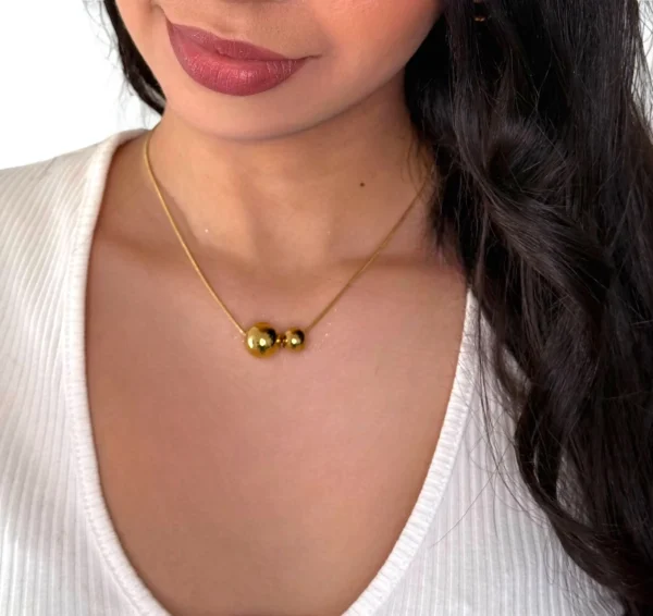 a woman wearing a necklace