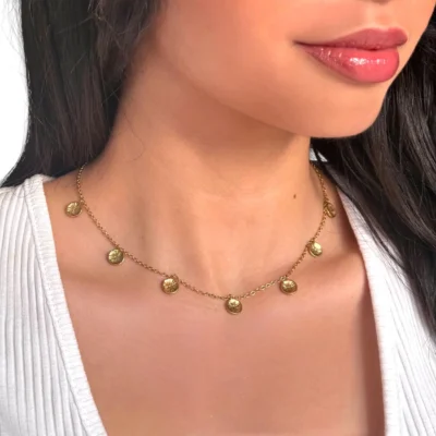 a woman wearing a necklace
